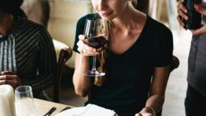 WSA Bangkok Wine class participant whiffing the wine