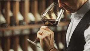 WSA Bangkok male sommelier participants whiffing red wine