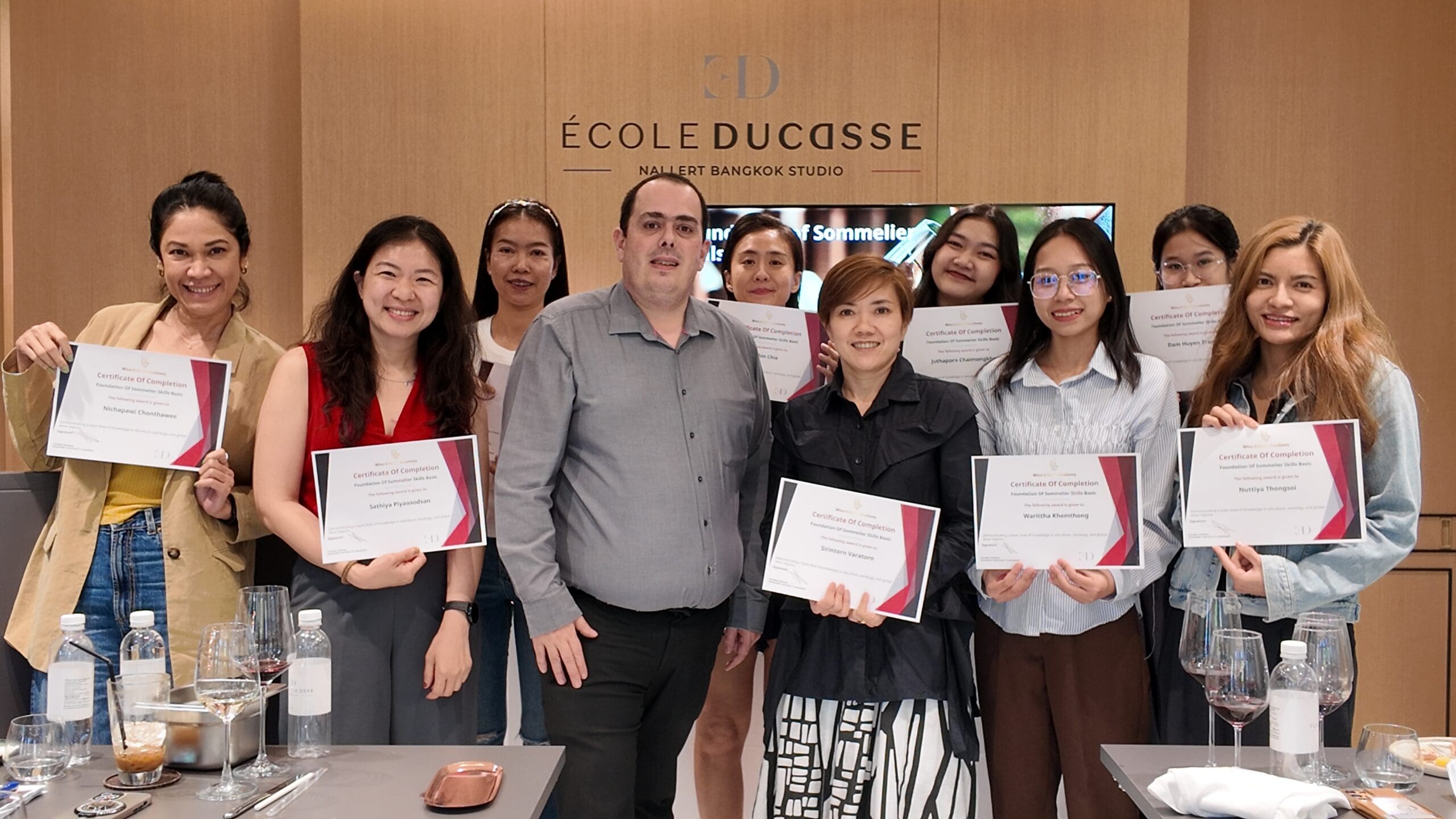 Students receiving certificates at the end of the Foundation of Sommelier Skills Basic course, Wine & Spirit Academy.